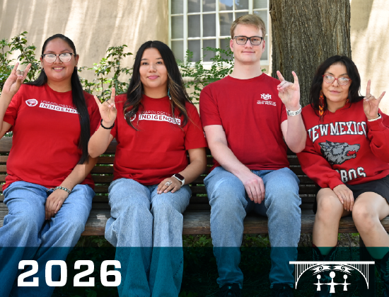 Picture of four residential advisors holding up their Lobo sign.